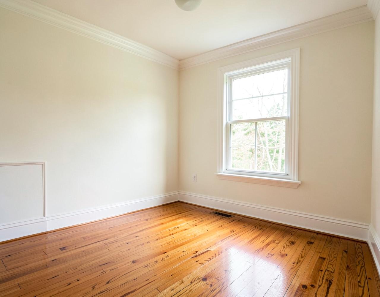 Freshly painted living room with refinished hardwood floor in a Westchester home